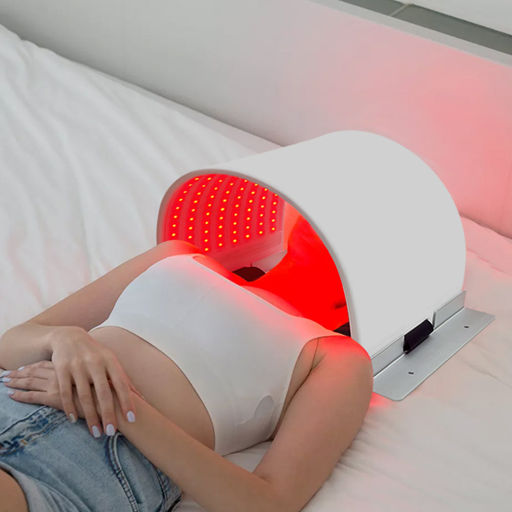 LMPH240 person lying down using the LED photon light therapy face mask with red light setting active